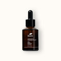 A brown glass bottle with black dropper of ikoni Feminine Vitality body oil.