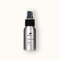 Polished metal spray bottle with black top of ikoni Multifunctional Spray.