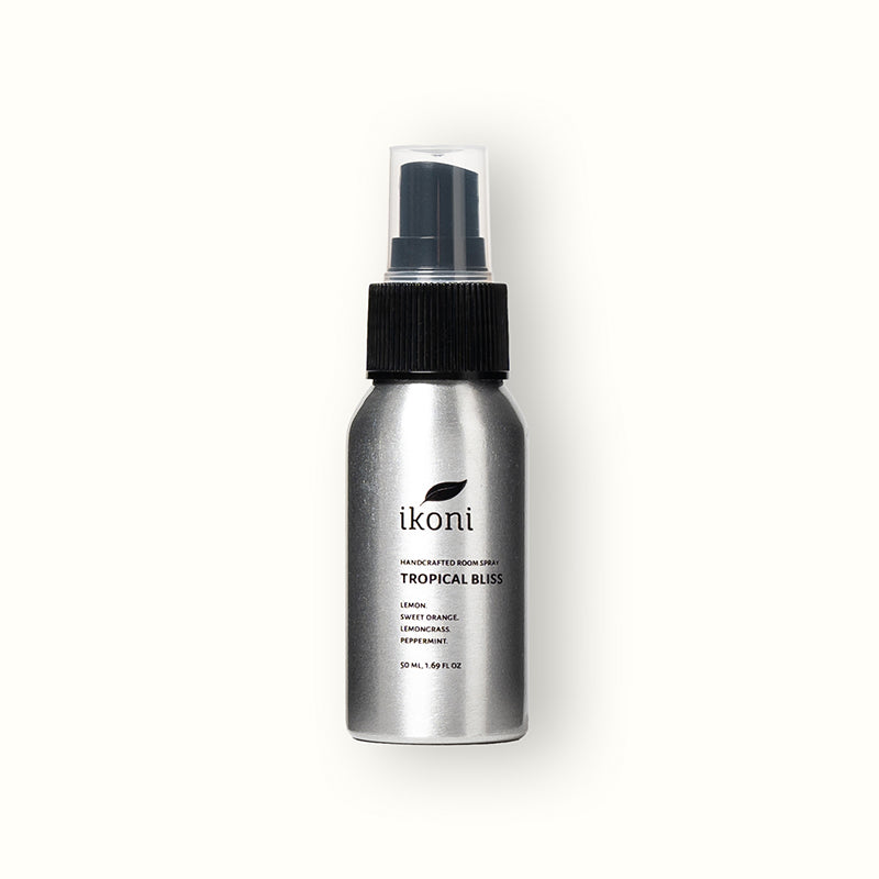 Polished metal spray bottle with black top of ikoni Multifunctional Spray.