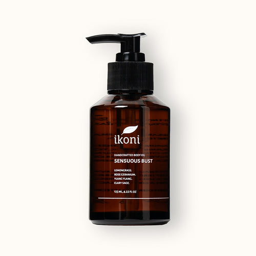 Brown bottle with black pump of ikoni Sensuous Bust body oil.