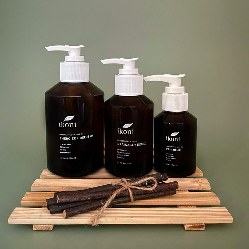 Three ikoni products on a wooden stand with a green background.